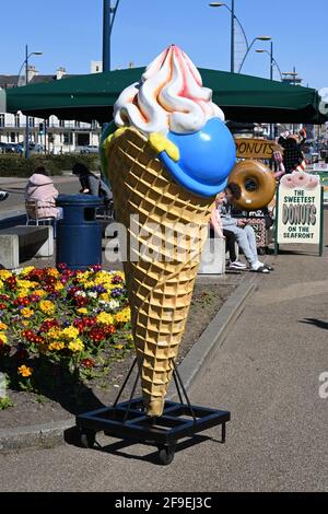 17th April 2021 great yarmouth plastic five foot ice cream cone with red syrup  standing outside a ice cream shop Stock Photo