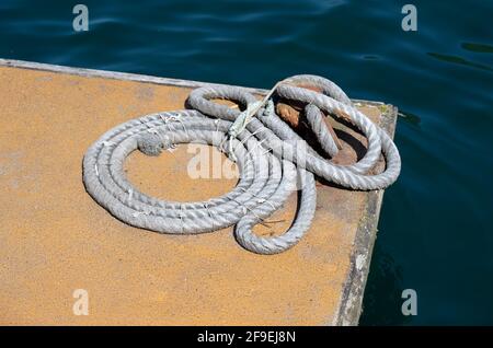 marine rope moored in the harbor Stock Photo