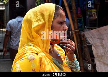 Kolkata, India. 18th Apr, 2021. A woman is not wearing protective mask inside of a market area amid the spread of Covid-19 in Kolkata. (Photo by Sudipta Das/Pacific Press) Credit: Pacific Press Media Production Corp./Alamy Live News Stock Photo