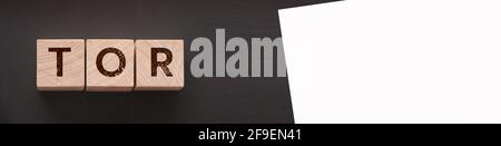 Tor anonymous by letters on a woden blocks on black. Business concept. Stock Photo