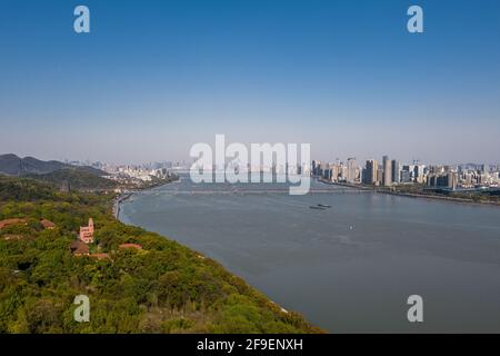 Aerial view of Qiantang River Bridge and modern city skyline in Hangzhou, China Stock Photo