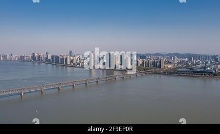 Aerial view of Qiantang River Bridge and modern city skyline in Hangzhou, China Stock Photo