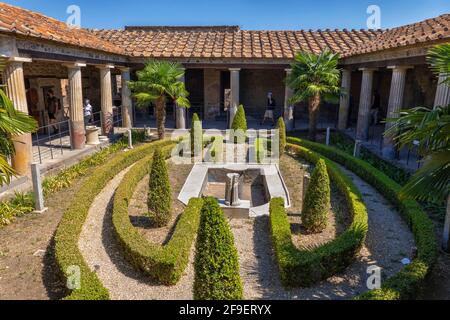 House of the Golden Cupids with garden in peristylium courtyard in ancient city of Pompeii, Campania, Italy Stock Photo