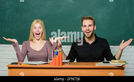 Relations with classmates. Students communicate classroom chalkboard background. Education concept. Communication between group mates. Friendship and Stock Photo