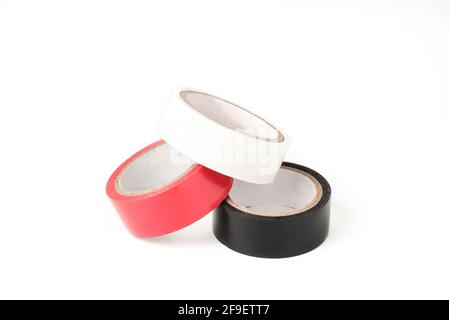 White, red and black adhesive tape rolls isolated on white Stock Photo