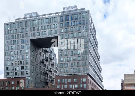 Brooklyn, NY - USA - April 17, 2021: A view 325 Kent, the doughnut-shaped luxury rental, part of the redevelopment of the historic Domino Sugar Distil Stock Photo