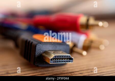 HDMI cable and analog audio video cable on old wood background close up Stock Photo