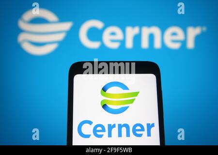 Ukraine. 18th Apr, 2021. In this photo illustration, the Cerner logo of a US information technology company seen displayed on a smartphone and a pc screen. (Photo by Pavlo Gonchar/SOPA Images/Sipa USA) Credit: Sipa USA/Alamy Live News Stock Photo