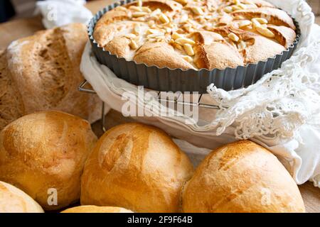 Home Baked  bread  and  pastries fresh from the  oven  on cooling  rack Stock Photo