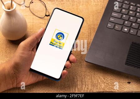 Assam, india - April 19, 2021 : Bharat Petroleum logo on phone screen stock image. Stock Photo