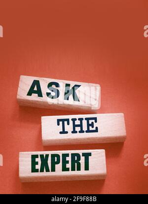 Ask the Expert words on wooden blocks. Consulting a professional, master or consultant for a solution and advice business concept. Stock Photo