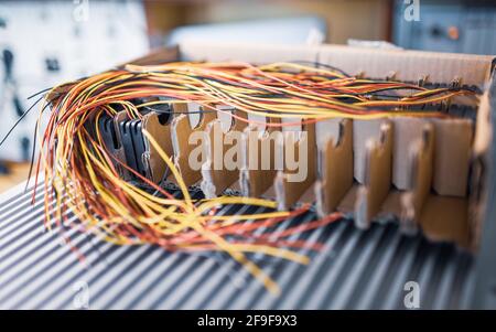 Bundle of cut thin wires with red connections Stock Photo by YouraPechkin