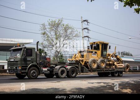 Chiangmai, Thailand - March  16 2021:  Private Komatsu Tractor on truck. On road no.1001, 8 km from Chiangmai city. Stock Photo