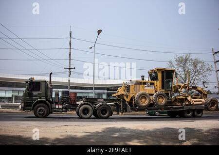 Chiangmai, Thailand - March  16 2021:  Private Komatsu Tractor on truck. On road no.1001, 8 km from Chiangmai city. Stock Photo