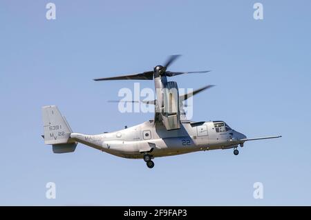 Bell Boeing MV-22B Osprey tilt rotor flying a demonstration at an airshow. US Marine Corps version of V-22 design. Early metallic paint scheme Stock Photo