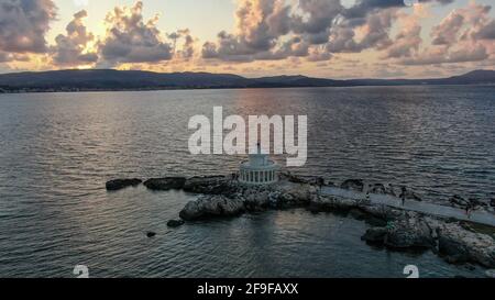 Sunset at the lighthouse of Saint Theodoroi near Argostoli city, aerial view, Kefalonia island, Ionian sea, Greece Stock Photo