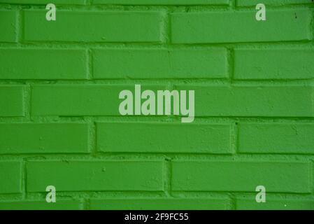 Masonry wall built with exposed brick blocks. Construction. Brick and concrete wall. Engineering and architecture work. Green building blocks backgrou Stock Photo