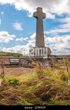 A memorial on the battleground between Scottish and English armies commemorates the battle of Flodden in 1513 in the form of a tall granite cross Stock Photo