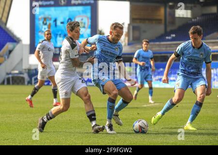 Birmingham, UK. 18th Apr, 2021. Kyle McFadzean #5 of Coventry City holds off Dominik Frieser #28 of Barnsley in Birmingham, UK on 4/18/2021. (Photo by Mark Cosgrove/News Images/Sipa USA) Credit: Sipa USA/Alamy Live News Stock Photo