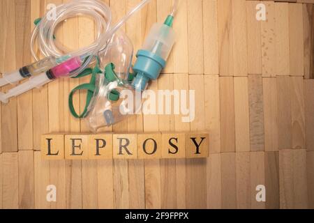 The word leprosy was crafted from wooden cubes. Health concept Stock Photo