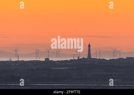 View of Blackpool including Blackpool Tower and offshore wind farm turbines with a distant Isle of Man in the background taken from Rivington, England Stock Photo