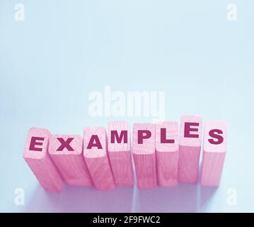 Examples word written on wooden blocks. Education or storytelling marketing concept. Stock Photo