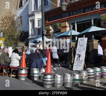 London, UK. 18th Apr, 2021. The Eagle Ale House, 104 Chatham Rd, London SW11 6HG.  Northcote road pedestrianised to allow businesses to recover after lockdown. Sunshine on Sunday as pubs and restaurants open to the crowds. Credit: JOHNNY ARMSTEAD/Alamy Live News Stock Photo