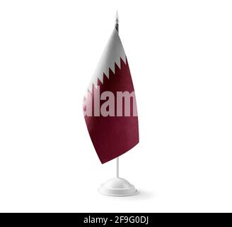 Small national flag of the Qatar on a white background Stock Photo