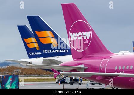 Keflavik, Iceland - July 3, 2017: WOW Air and Icelandair Airbus Boeing airplane tails at Reykjavik Keflavik airport (KEF) in Iceland.