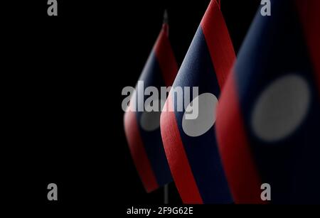 Small national flags of the Laos on a black background Stock Photo