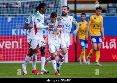 LEUVEN, BELGIUM - APRIL 18: Siebe Schrijvers of OH Leuven celebrating the first goal of his side, with (L) Kamal Sowah of OH Leuven, Xavier Mercier of Stock Photo