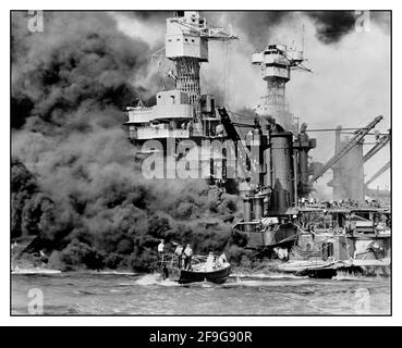 PEARL HARBOR ATTACK WW2 Dec. 7, 1941  a small boat rescues a seaman from the USS West Virginia burning in the foreground in Pearl Harbor, Hawaii, after Japanese aircraft attacked the military installation. . World War II Pacific war Japanese aggression Stock Photo