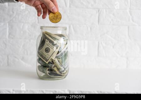 Composition with saving money banknotes in a glass jar. Concept of investing and keeping money, close up Stock Photo