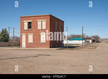 Abandoned building on a street in the village of Empress, Alberta, Canada Stock Photo