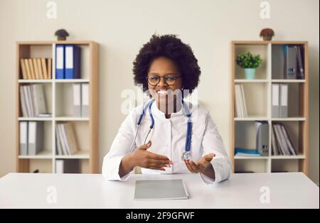 Head shot portrait of african american female doctor talking to camera Stock Photo