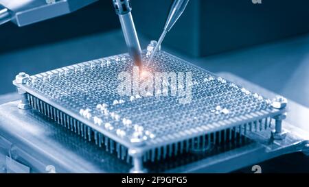 automatic machinery for soldering electronic components. soldering iron tips of robotic system for automatic point soldering for printed and assembly Stock Photo