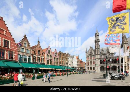 Market with neo-Gothic Provinciaal Palace Provinciaal Hof, and houses with stepped gables on the north side of the square, Old Town of Bruges Stock Photo