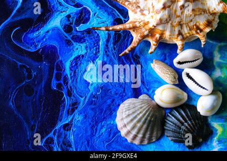 Seashells on a bright background. Acrylic Pouring Stock Photo