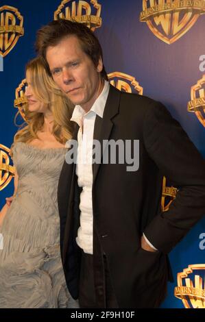 (L-R) Actress Kyra Sedgwick and actor Kevin Bacon attends arrivals for the 58th Annual Primetime Emmy Awards Warner Bros. Television Party at Cicada on August 28, 2006 in Los Angeles, California. Stock Photo