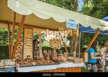 DOMZALE, SLOVENIA - Jun 21, 2019: Stands offering beautiful handmade straw products on summer festival Stock Photo