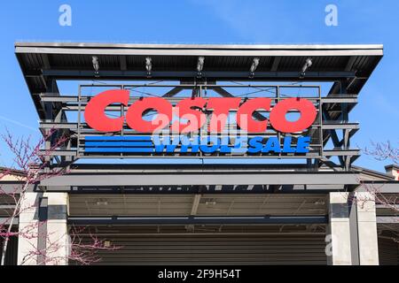 Costco Wholesale sign over the entrance, on a frame, to the company warehouse in Redmond Washington in blue and red Stock Photo