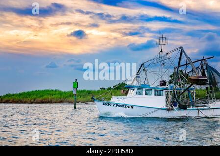 “Empty Pockets” shrimp boat heads out on a shrimping trip, July 7, 2012, in Bayou La Batre, Alabama. Stock Photo