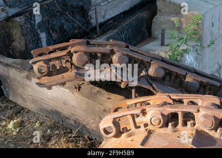 The heavy metal ruins of lumber mill machinery remain on the shores of Lake Ewauna in Klamath Falls, Oregon. Stock Photo