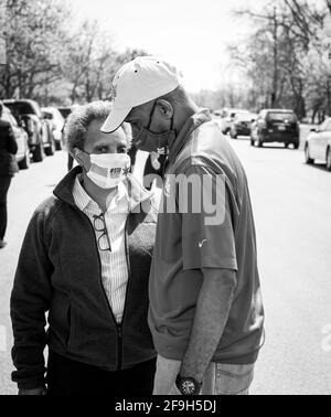 CHICAGO, IL. USA MAY 16, 2020: CHICAGO MAYOR LORI LIGHTFOOT & ALDERMAN DAVID MOORE HAVING A DISCUSSION AT A FOOD GIVEAWAY DURING COVID 19 CRISIS Stock Photo