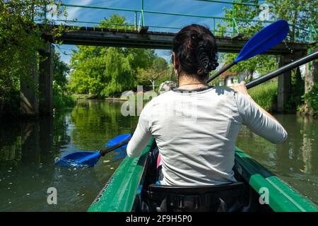 BERLIN, GERMANY - May 08, 2020: BERLIN, GERMANY May 08, 2020. A mother and her son paddle in a boat in nice sunny weather Stock Photo