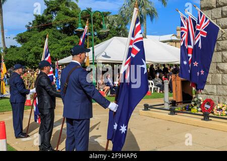 Sandgate Queensland Australia - April 2019. Ex Service men holding flags with officals in backgroud and shrine in front for ANZAC Day ceromy Stock Photo