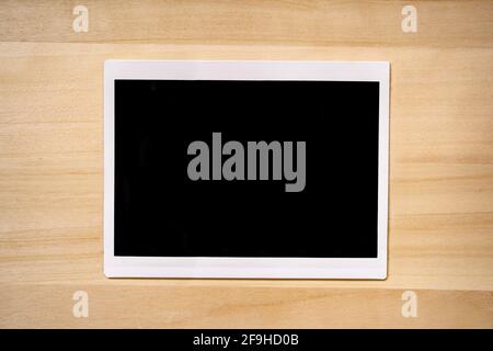 4x6 inches photo frame on wood background Stock Photo