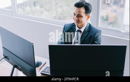 Asian business people are focused on working Stock Photo