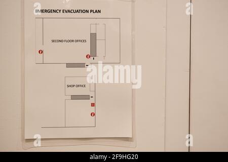 Emergeny Evacuation Plan template fixed on an Office Wall Stock Photo