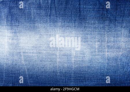 Blue jeans texture close up, aged jean textile background, dark light blue denim backdrop, faded jeans pattern design, shabby indigo jeans cloth Stock Photo